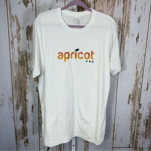 Bella Canvas, White Tee with Orange Apricot Pro Logo. Size XL. Excellent cond!
